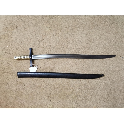 147 - 20th C. French bayonet in original scabbard with brass hilt {72 cm L}.