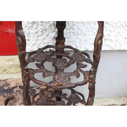 15 - Pair of decorative cast iron three tier planters { 67cm H X 30cm Dia }.