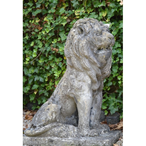 2 - Pair of stone figures of seated Lion's raised on rectangular plinth {96 cm H x 72 cm W x 42 cm D}.