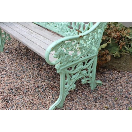 22 - Decorative cast iron garden seat with wooden seat { 93cm H X 120cm W X 44cm D }.