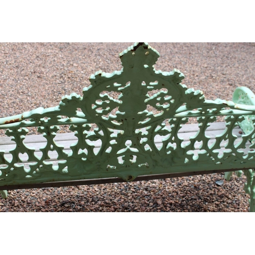 22 - Decorative cast iron garden seat with wooden seat { 93cm H X 120cm W X 44cm D }.
