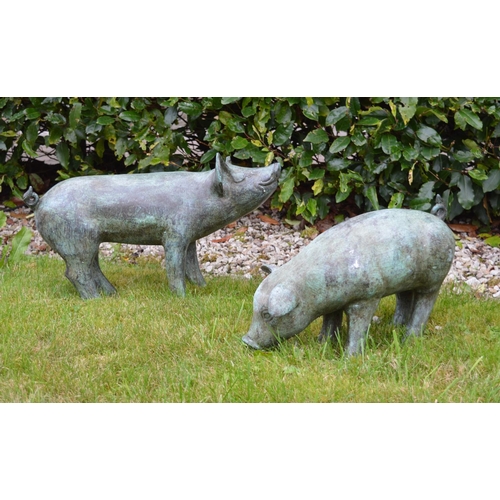 46 - Pair of bronze models of Piglets {35 cm H x 58 cm W}.