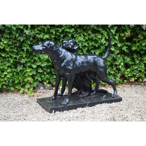 49A - Lifesize cast iron group of two hounds on rectangular base {75 cm H x 95 cm W x 50 cm D}.