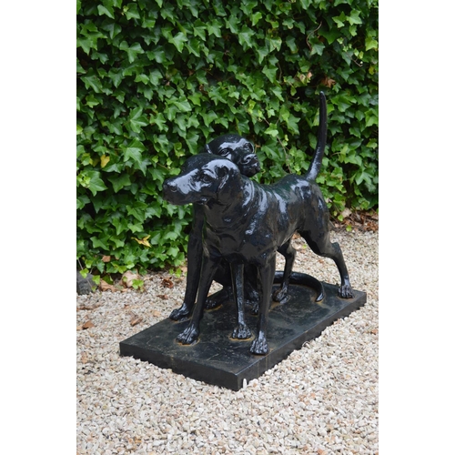 49A - Lifesize cast iron group of two hounds on rectangular base {75 cm H x 95 cm W x 50 cm D}.