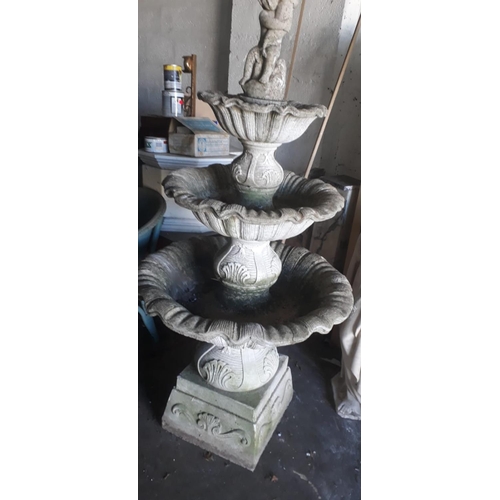 9 - Three tier stone fountain decorated with  cherub {152 cm H x 86 cm Dia.}.