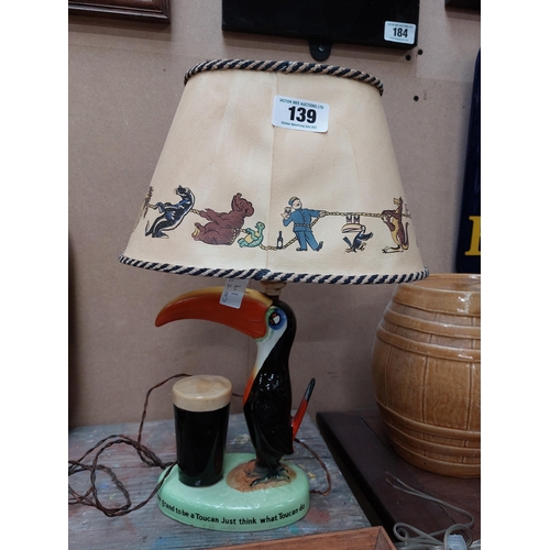 139 - Guinness Toucan ceramic advertising lamp with original shade {43 cm H x 32 cm W x 20 cm D}.