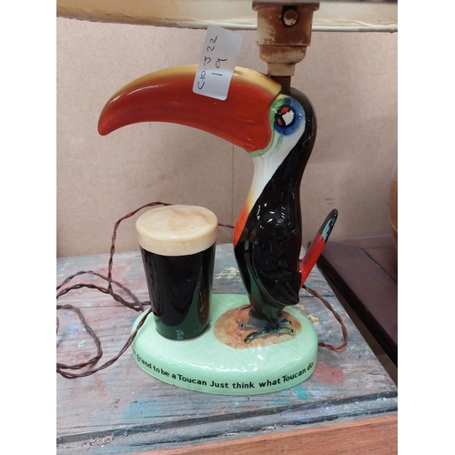 139 - Guinness Toucan ceramic advertising lamp with original shade {43 cm H x 32 cm W x 20 cm D}.