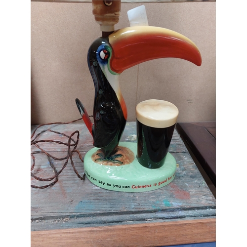 139 - Guinness Toucan ceramic advertising lamp with original shade {43 cm H x 32 cm W x 20 cm D}.