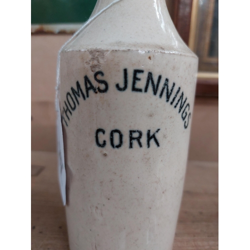 147 - Thomas Jennings Cork stoneware Ginger beer bottle. {17 cm H x 7 cm Dia}.