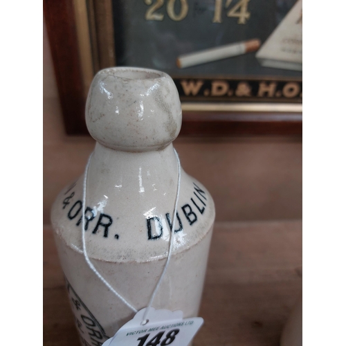 148 - Hovenden and Orr Dublin stoneware Ginger beer bottle. { 17 cm H x 7 cm Dia}.