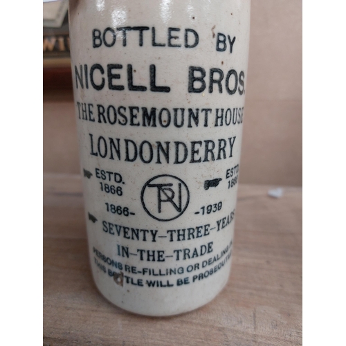 152 - Nicell Bros The Rosemount House Londonderry stoneware Ginger beer bottle. {20 cm H x 7 cm Dia}