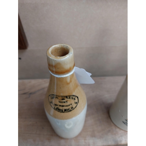 153 - John Keill Wine Merchant Limerick stoneware Ginger beer bottle. { 20 cm H x 7 cm Dia}