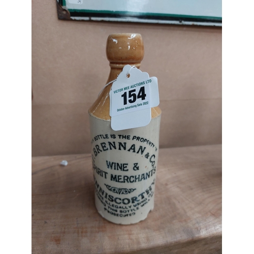 154 - P Brennan and Co Enniscorthy stoneware Ginger beer bottle. { 17 cm H x 7 cm Dia}.