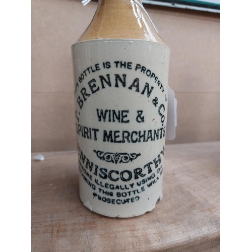 154 - P Brennan and Co Enniscorthy stoneware Ginger beer bottle. { 17 cm H x 7 cm Dia}.