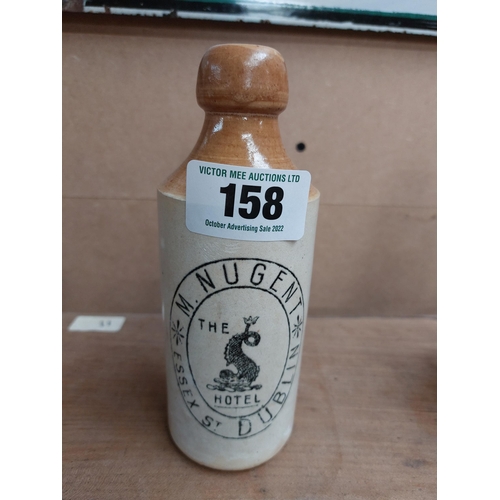 158 - M Nugent Essex St Dublin stoneware Ginger beer bottle. { 18 cm H x 7 cm Dia}.