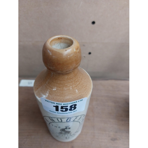 158 - M Nugent Essex St Dublin stoneware Ginger beer bottle. { 18 cm H x 7 cm Dia}.