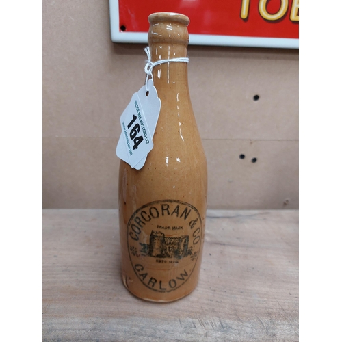 164 - Corcoran and Co Carlow stoneware Ginger beer bottle. { 20 cm H x 7 cm Dia}.