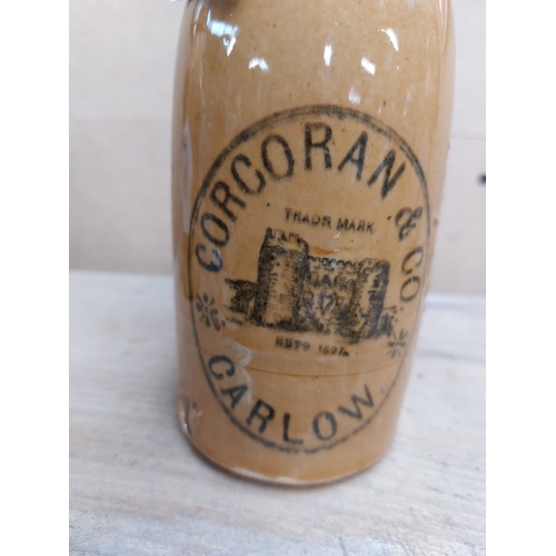 164 - Corcoran and Co Carlow stoneware Ginger beer bottle. { 20 cm H x 7 cm Dia}.