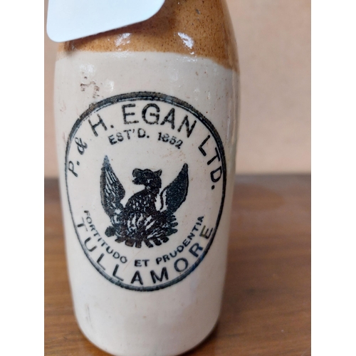 200 - P and H Egan Tullamore stoneware Ginger beer bottle. { 20 cm H x 7 cm Dia}.