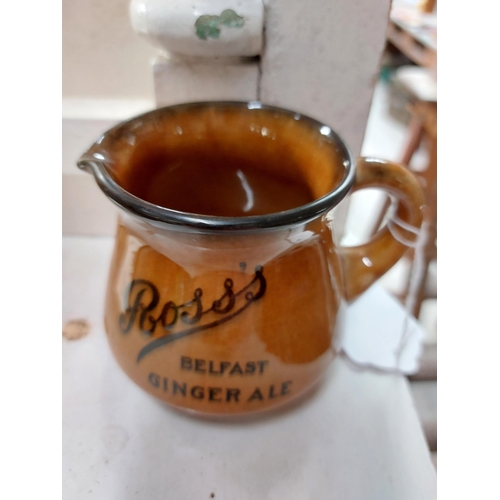 221 - Ross's Ginger Ale Belfast ceramic water jug. {8 cm H x 10 cm W x 12 cm D}.