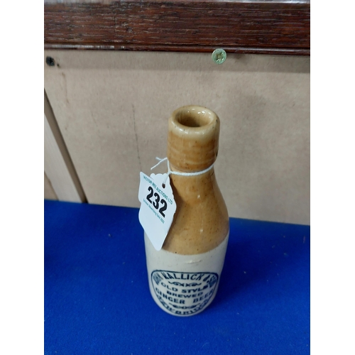 232 - John Mallick and Sons Newbridge stoneware Ginger beer bottle. {20 cm H x 7 cm Dia}.