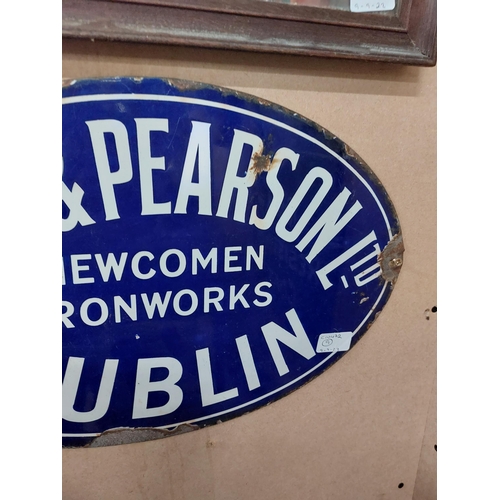 252 - Smith and Pearson Ltd Newcomen Ironworks Dublin oval enamel advertising sign. {46 cm W}.