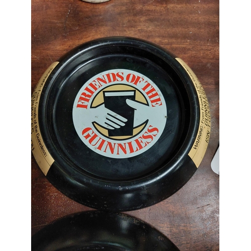 270 - Four tinplate Guinness ashtrays. {15 cm Dia}.