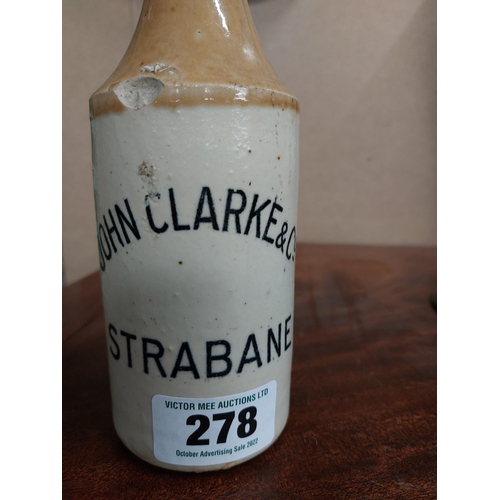 278 - John Clarke and Co Strabane stoneware Ginger beer bottle. { 20 cm H x 7 cm Dia}.