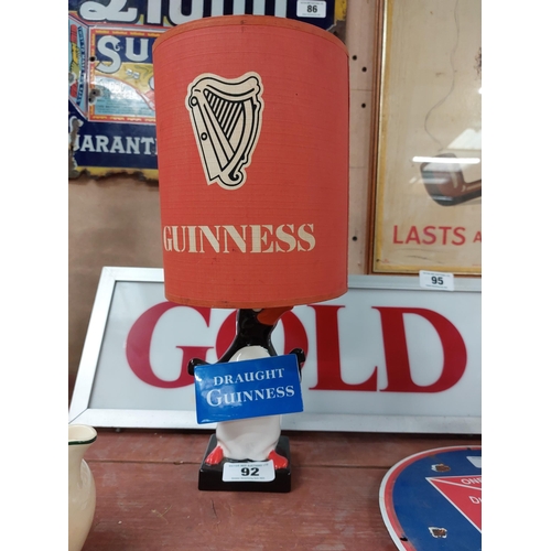 92 - Guinness Penguin Lamp with original shade. { 38 cm H x 17 cm Dia}.