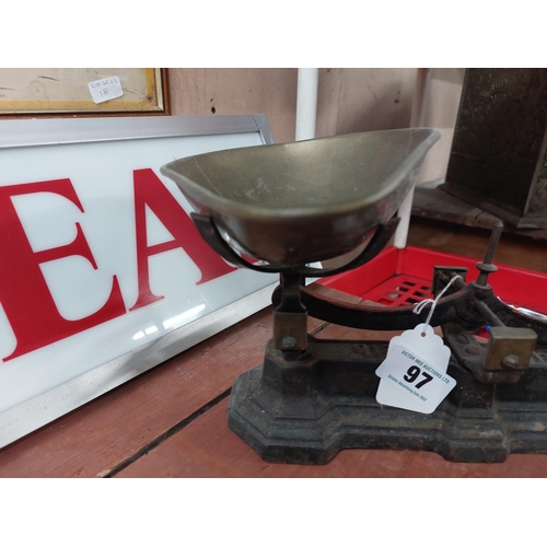 97 - 19th. C.  cast iron and brass sweet scales with weights. {19 cm H x 36 cm W x 20 cm D}.