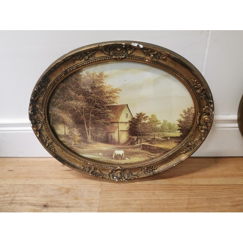 1006 - Pair of Farmyard scene coloured prints mounted in oval giltwood frames { 38cm H X 48cm W }.