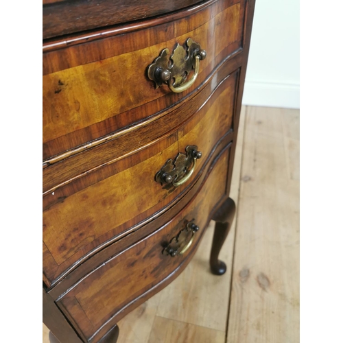 1010 - Edwardian burr walnut bedside locker with three graduated drawers raised on cabriole legs { 74cm H X... 