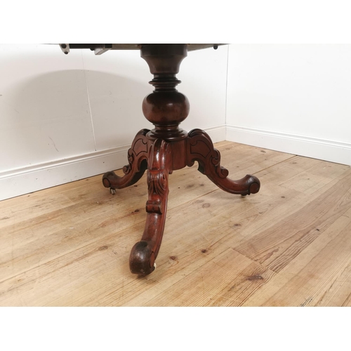 1014 - 19th. C. mahogany breakfast table the oval top raised on turned column and three outswept feet { 75c... 