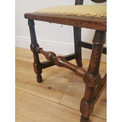 1017 - 19th C. oak side chair with upholstered back and seat raised on turned legs and single stretcher {11... 