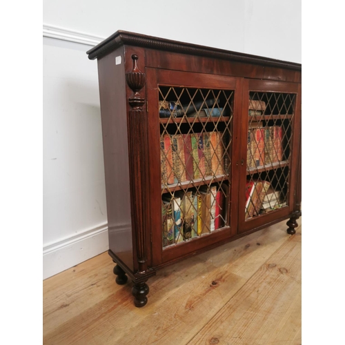 1020 - Regency mahogany side cabinet the two doors with brass grilles flanked by reeded columns raised on t... 