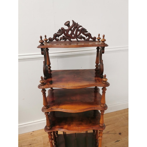 1022 - 19th. C. mahogany five tier serpentine fronted whatnot raised on turned columns { 130cm H X 50cm W X... 