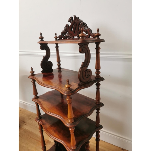 1022 - 19th. C. mahogany five tier serpentine fronted whatnot raised on turned columns { 130cm H X 50cm W X... 