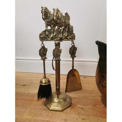 1030 - Brass coal helmet  { 48cm H X 31cm W X 37cm D } and two sets of brass fire irons { 45cm H }.