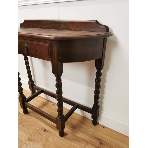 1032 - Edwardian oak hall table with single drawer in the frieze raised on barley twist legs { 86cm H X 87c... 