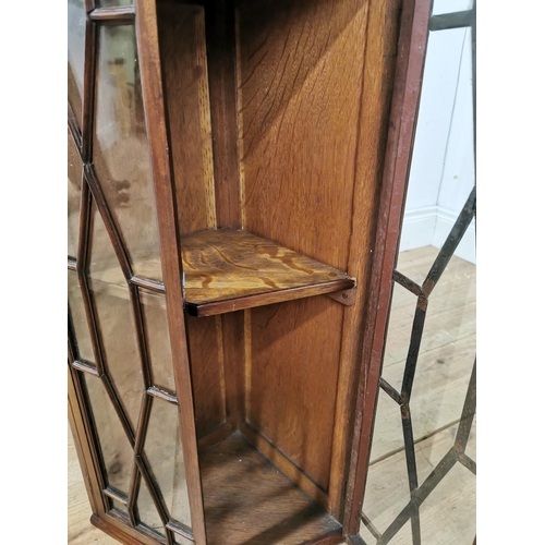 1057 - Edwardian mahogany corner cupboard with two astragal glazed doors. { 72cm H X 40cm W X 30cm D }.