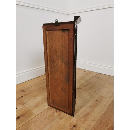 1057 - Edwardian mahogany corner cupboard with two astragal glazed doors. { 72cm H X 40cm W X 30cm D }.