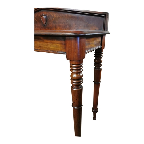 106 - 19th. C. mahogany consul table the gallery back decorated with a shield raised on turned tapered leg... 