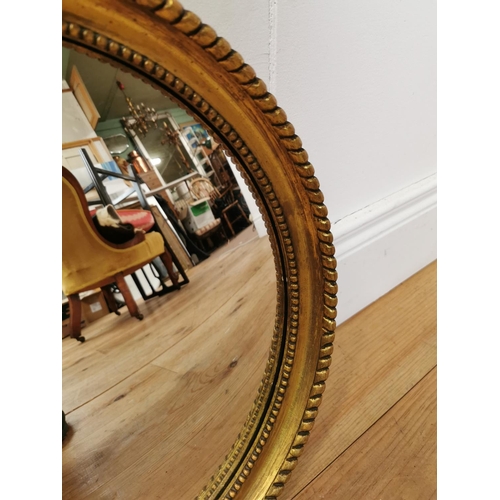 1061 - Edwardian convex wall mirror mounted in giltwood frame { 41cm Dia }.