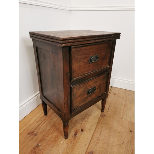 1063 - Hardwood bedside locker with two short drawers raised on turned legs { 77cm H X 55cm W X 41cm D }.