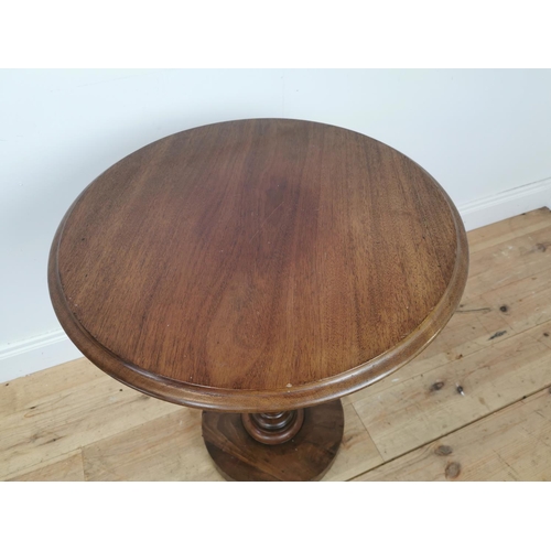 1069 - 19th. C. mahogany lamp table on turned column and platform base. {79 cm H x 57 cm Diam}.