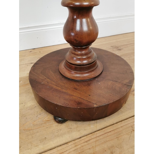 1069 - 19th. C. mahogany lamp table on turned column and platform base. {79 cm H x 57 cm Diam}.