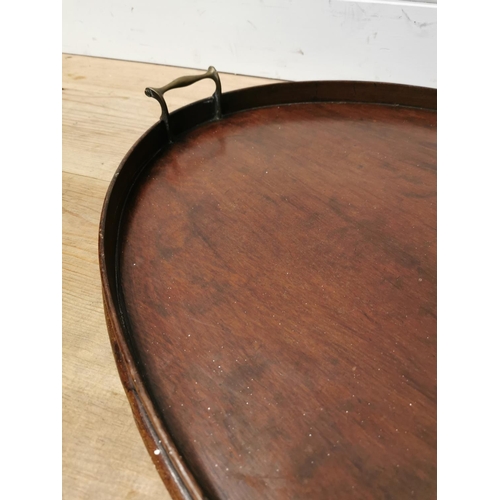 1083 - Early 19th. C. mahogany serving tray with original brass handles { 8cm H X 77cm W X 52cm D }.