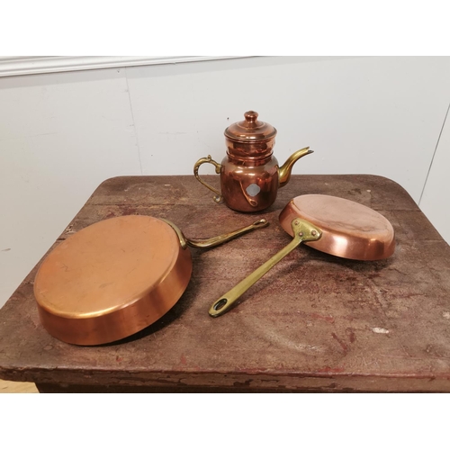 114 - Two copper and brass pans and a teapot