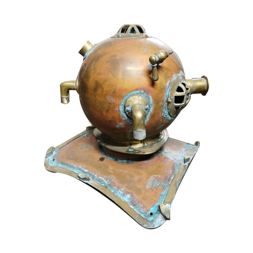 118 - Brass and copper diver's helmet { 38cm H X 46cm W X 41cm D }.