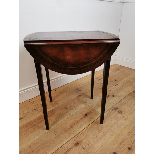 120 - Mahogany drop leaf lamp table with inset leather top raised on square reeded legs in the Georgian ma... 